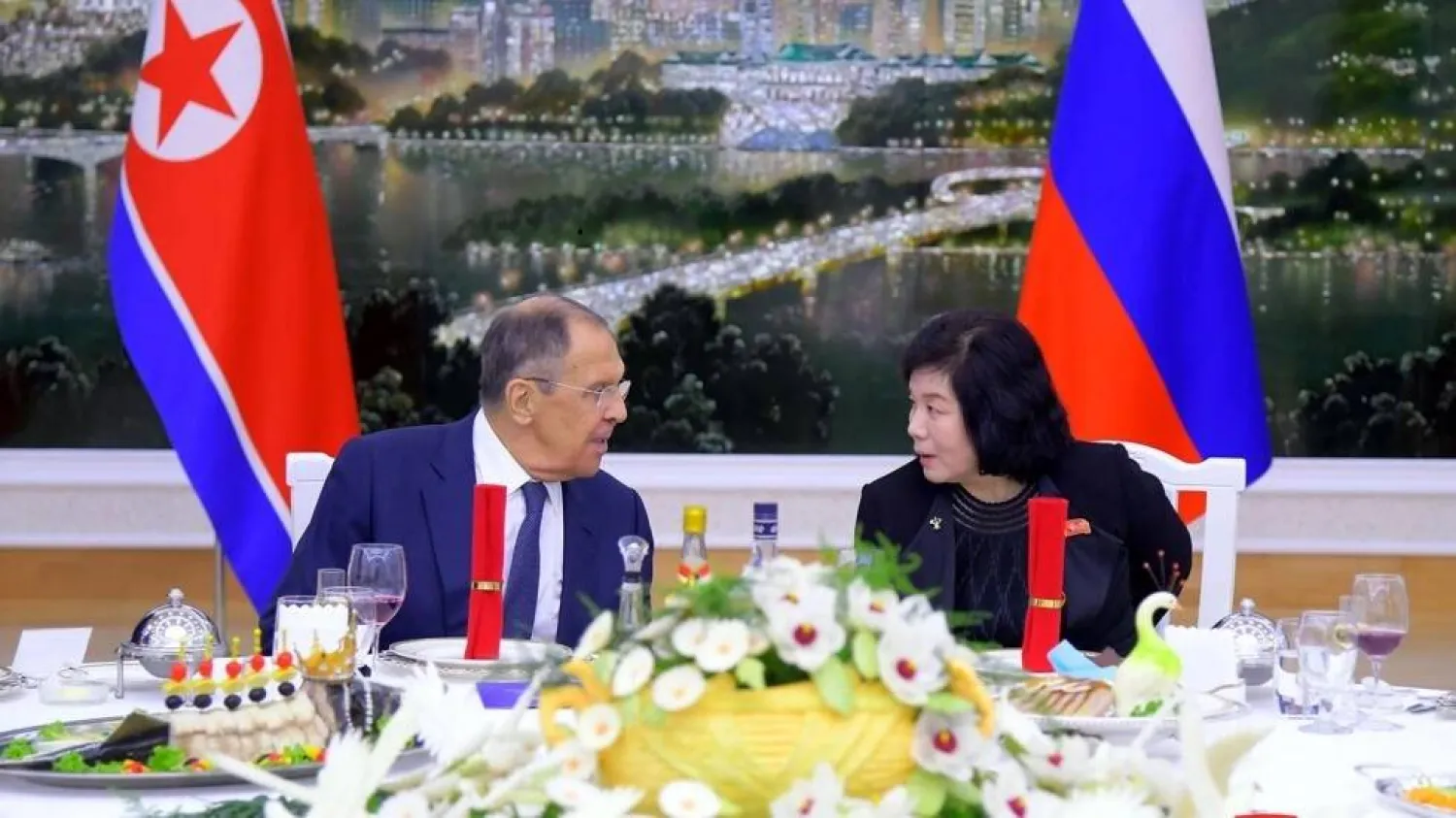 Russian Foreign Minister Sergei Lavrov (L) chats with North Korean counterpart Choe Son Hui at a welcome banquet in Pyongyang on Wednesday night. STR / KCNA VIA KNS/AFP