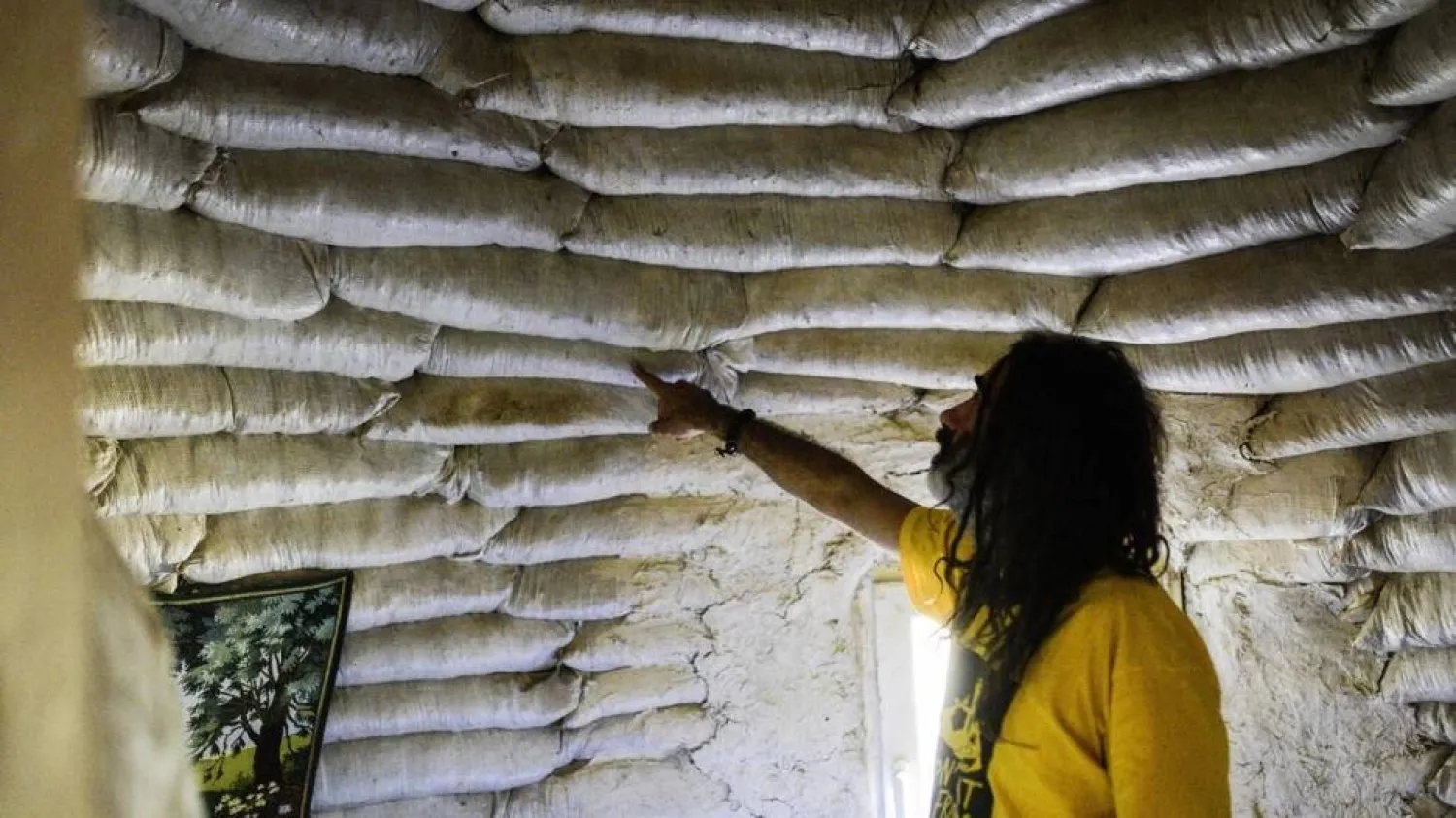 Going back to the land: Dimche Ackov inside his circular home made from clay. Robert ATANASOVSKI / AFP
