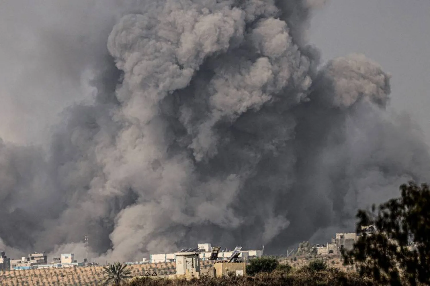 A picture taken from the southern Israeli city of Sderot on October 23, 2023, shows smoke and debris ascending over the northern Gaza Strip following an Israeli strike, amid the ongoing battles between Israel and the Palestinian group Hamas. (AFP)