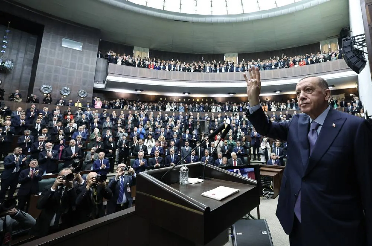 A handout photo made available by the Turkish President Press Office shows Turkish President Recep Tayyip Erdogan waving as he addresses members of ruling Justice and Development Party (AKP) at their parliamentary group meeting at the parliament in Ankara, Türkiye, 25 October 2023. (EPA/Turkish President Press Office Handout) 