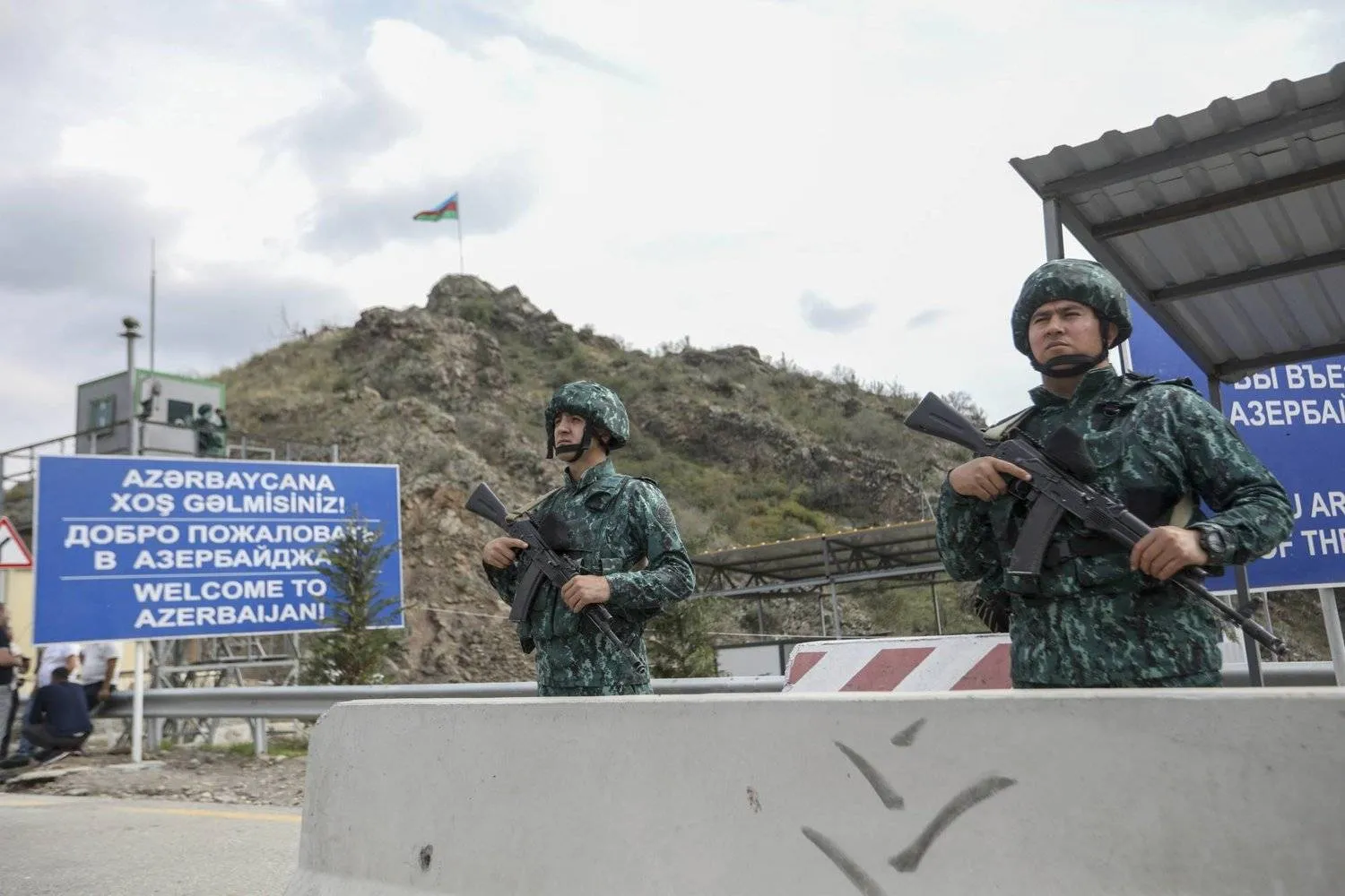Azerbaijani servicemen guard the Lachin checkpoint in Azerbaijan, Sunday, Oct. 1, 2023. (AP Photo/Aziz Karimov)
