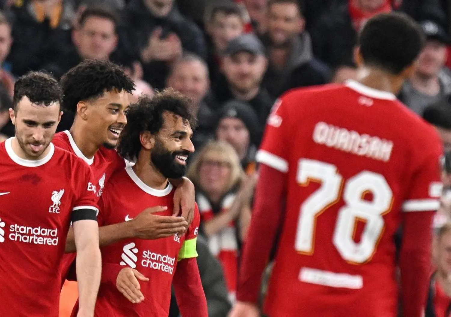 Liverpool's Egyptian striker #11 Mohamed Salah (C) celebrates scoring the team's fifth goal during the UEFA Europa League group E football match between Liverpool and Toulouse at Anfield in Liverpool, north west England on October 26, 2023. Liverpool won the match 5-1. (AFP)