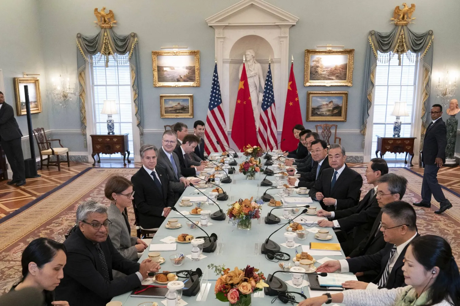US Secretary of State Antony Blinken, left, and Chinese Foreign Minister Wang Yi, right, with their delegations during a bilateral meeting at the State Department in Washington, Friday, Oct. 27, 2023. (AP Photo/Jose Luis Magana)