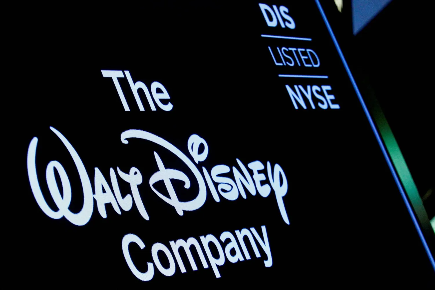 FILE PHOTO: A screen shows the logo and a ticker symbol for The Walt Disney Company on the floor of the New York Stock Exchange (NYSE) in New York, US, December 14, 2017. REUTERS/Brendan McDermid/File Photo