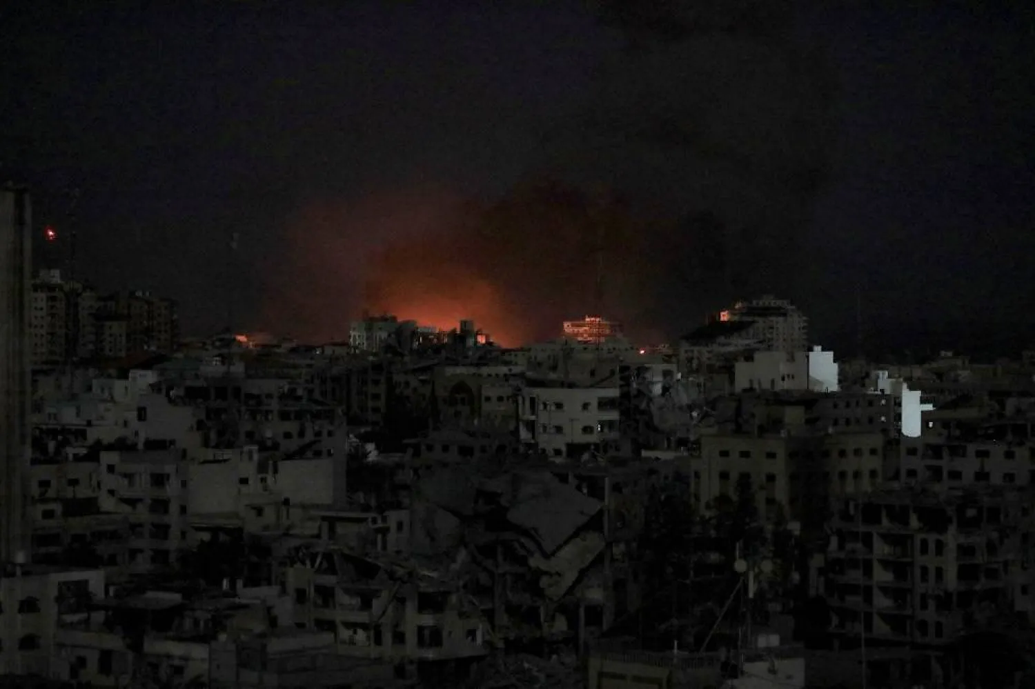 Flames rise during an Israeli air strike on west Gaza, October 30, 2023. (Reuters)
