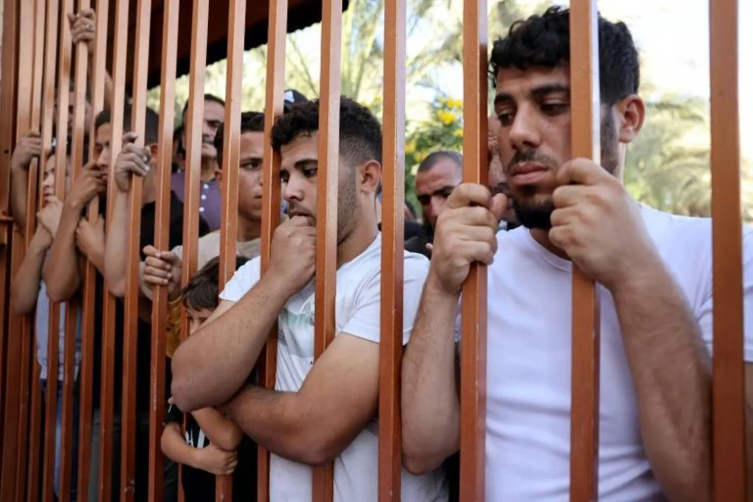 Palestinians wait outside the Nasser hospital to claim the bodies of relatives - AFP