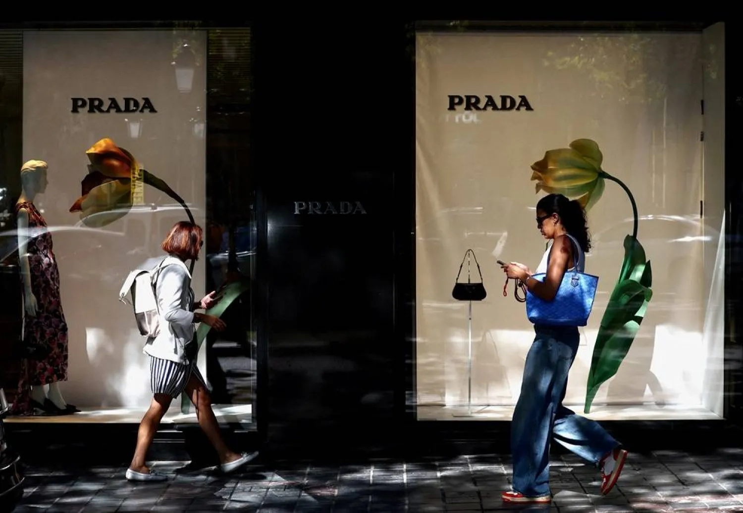 People walk past a Prada store in Brussels, Belgium September 5, 2023. (Reuters)