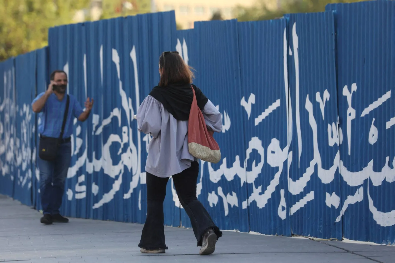 FILE PHOTO: An Iranian woman walks on a street in Tehran, Iran August 13, 2023. Majid Asgaripour/WANA (West Asia News Agency) via REUTERS