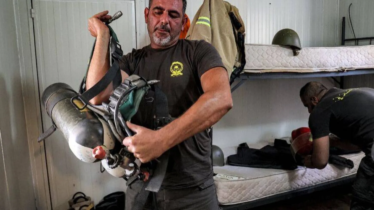 Members of the Civil Defense in Jdeidet Marjayoun Center 26 October 2023 - ANWAR AMRO/AFP