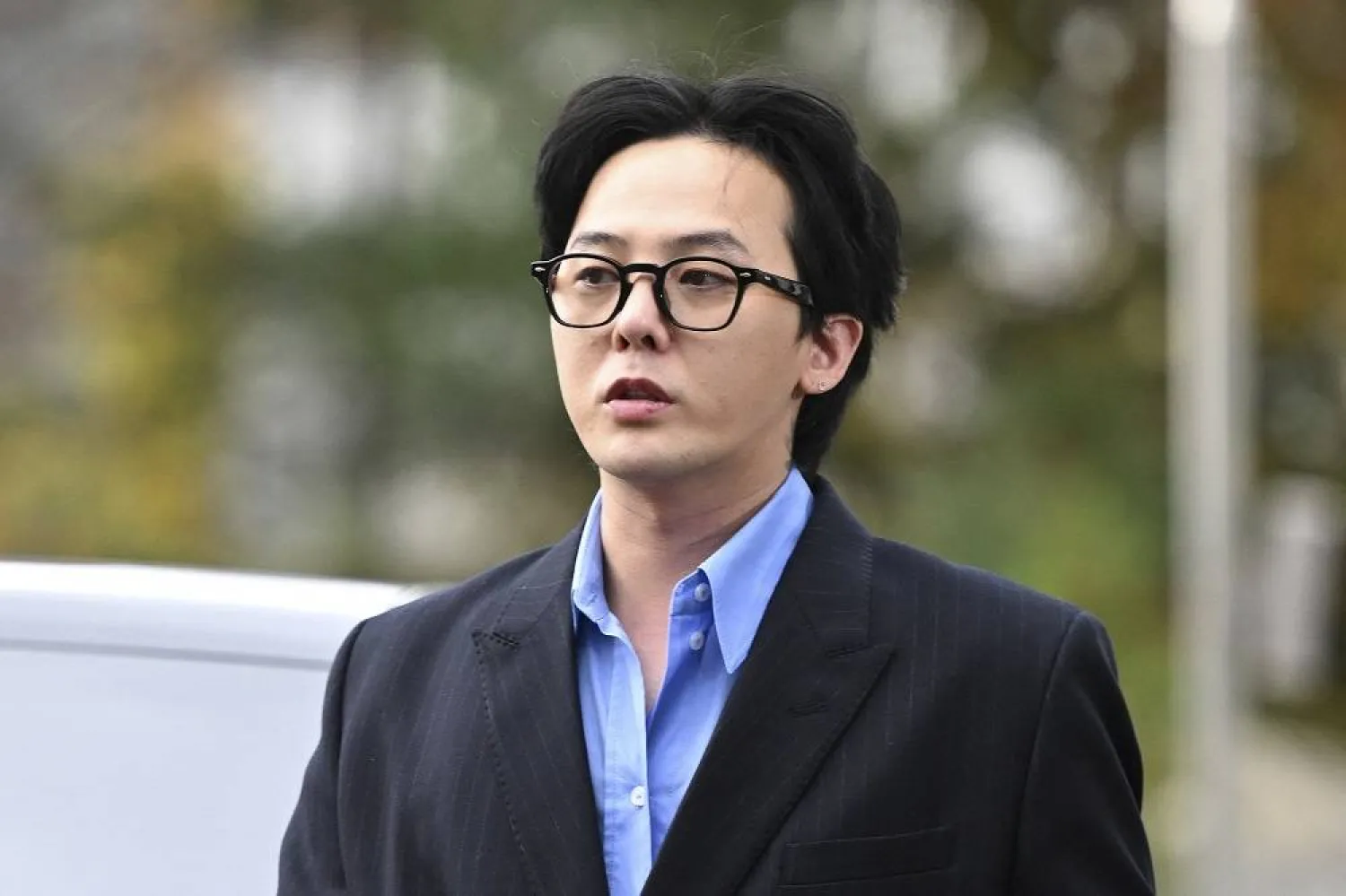 K-pop star G-Dragon arrives at a police station for his police questioning in Incheon on November 6, 2023. (AFP) 