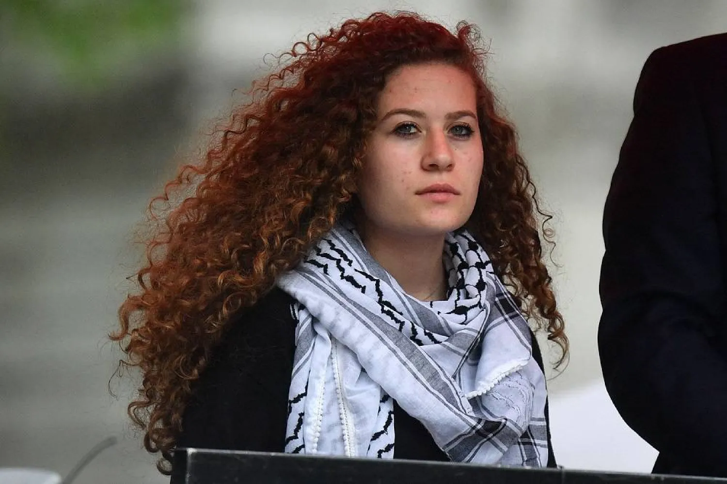 Palestinian activist Ahed Tamimi waits to speak at a rally calling for justice for Palestinians amid a growing threat of further war in the Middle East, in central London on May 11, 2019. (AFP)