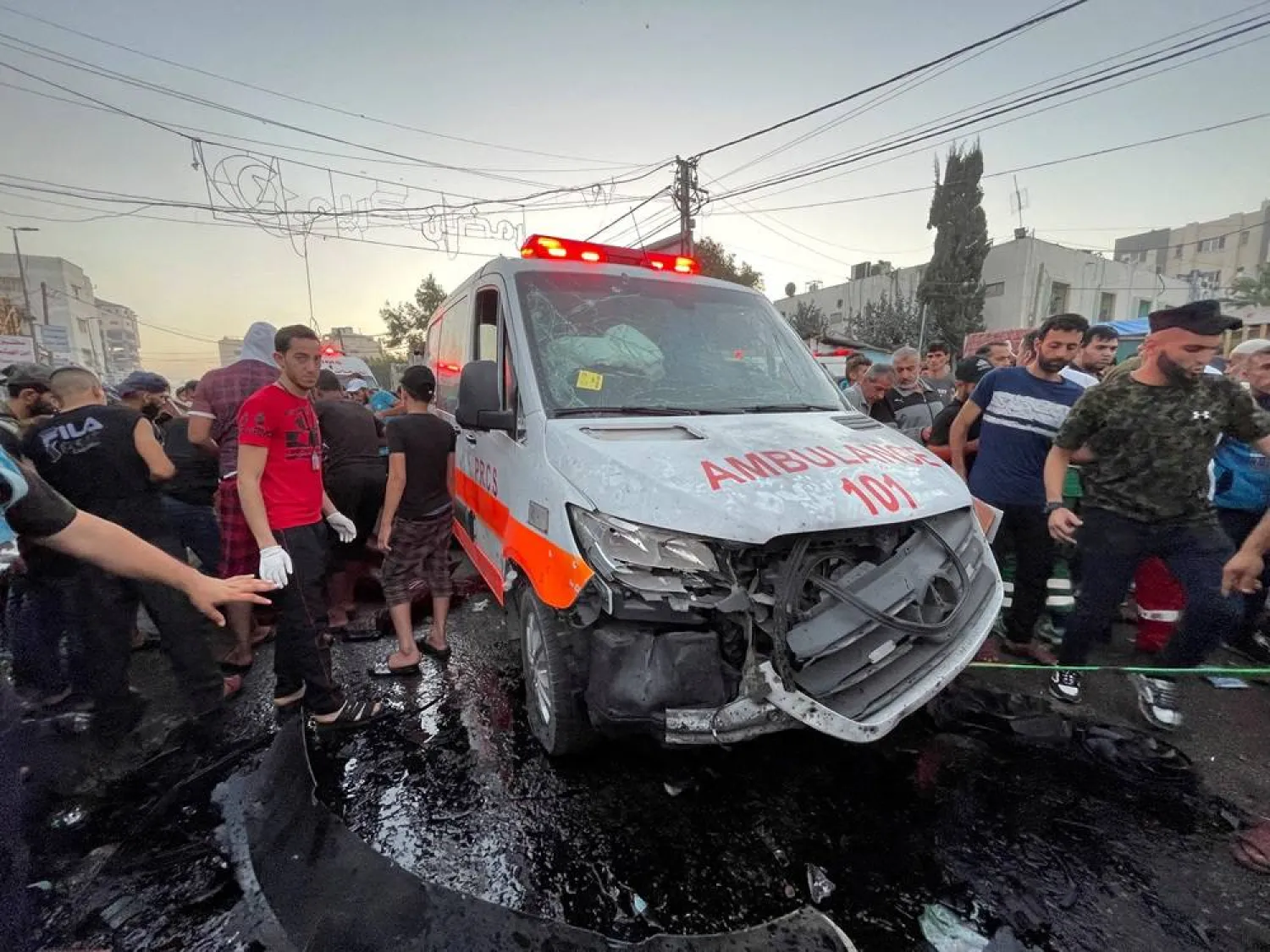 Palestinians check the damages after a convoy of ambulances was hit, at the entrance of al-Shifa hospital in Gaza City, November 3, 2023. (Reuters)