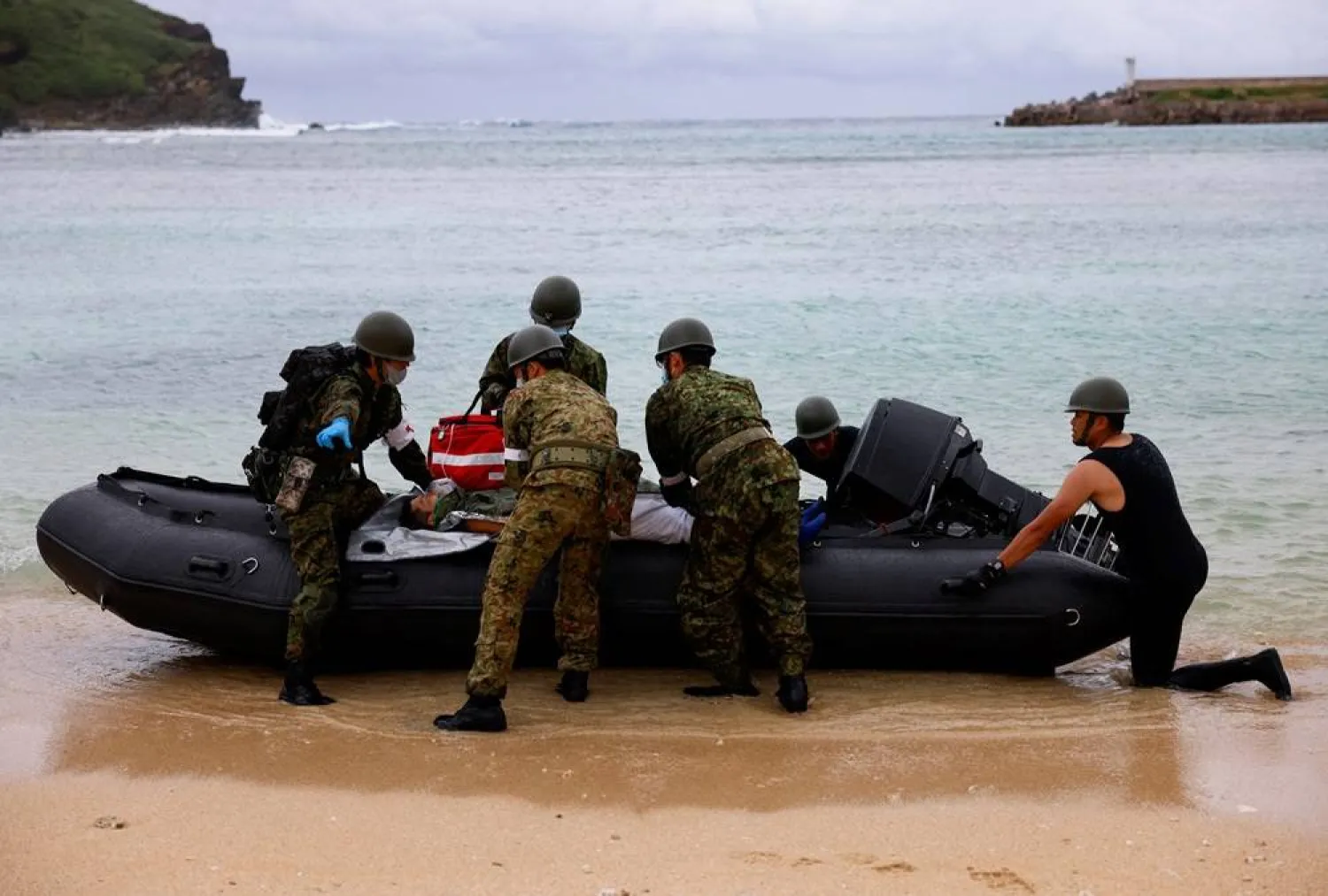 Japan Self-Defense Forces soldiers take part in an evacuation drill on Yonaguni island, Japan's westernmost inhabited island in Okinawa prefecture, Japan November 12, 2023. (Reuters)
