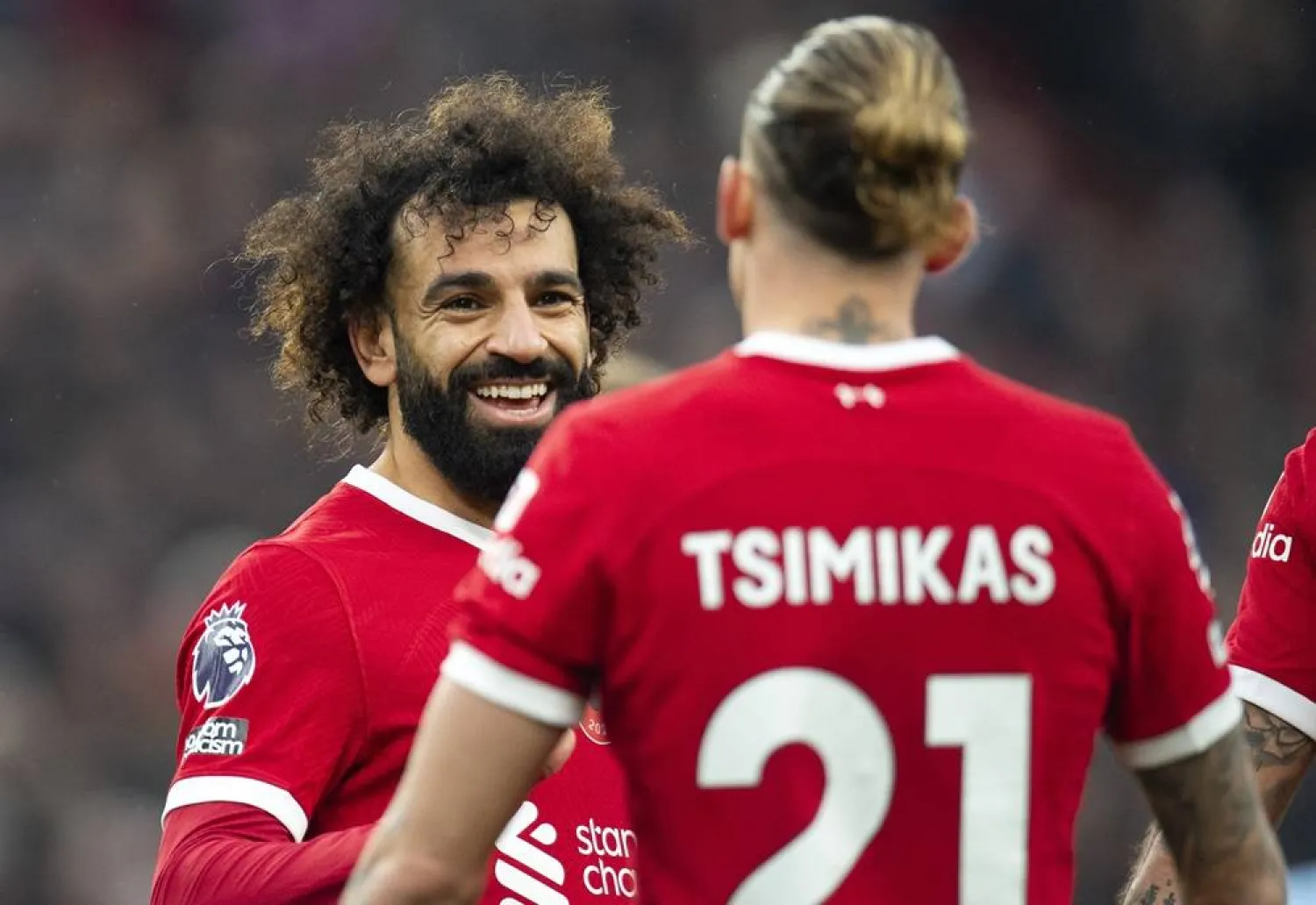 Mohamed Salah (L) of Liverpool celebrates with teammate Konstantinos Tsimikas after scoring the 2-0 goal during the English Premier League soccer match between Liverpool FC and Brentford FC, in Liverpool, Britain, 12 November 2023. (EPA)