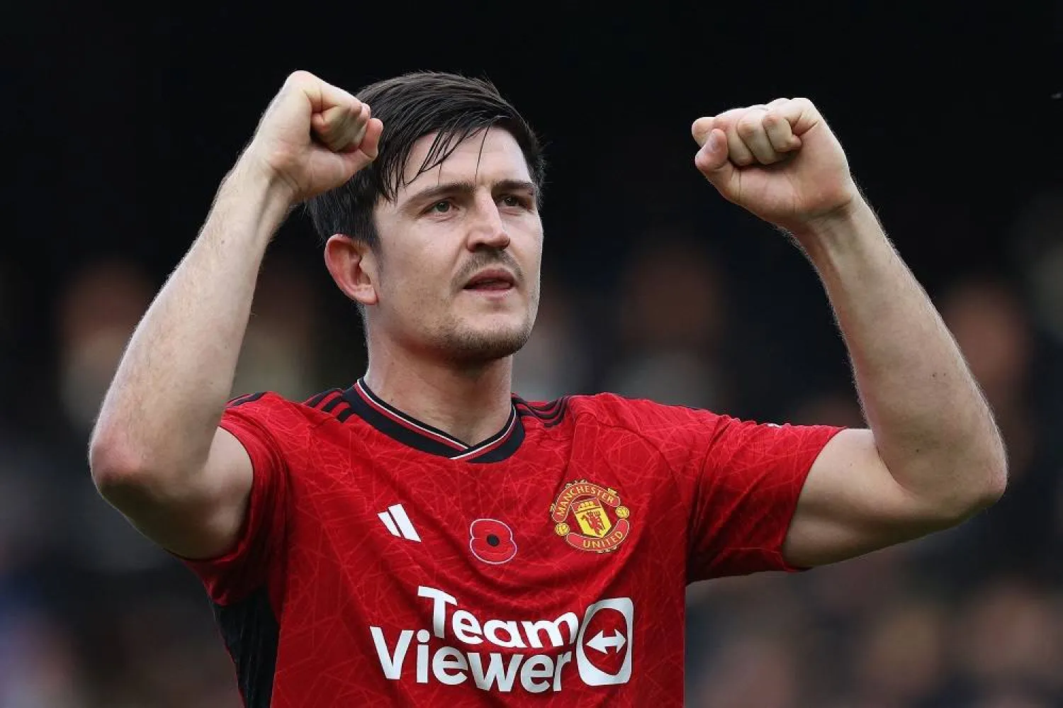 Manchester United's English defender #05 Harry Maguire applauds the fans following the English Premier League football match between Fulham and Manchester United at Craven Cottage in London on November 4, 2023. (AFP)