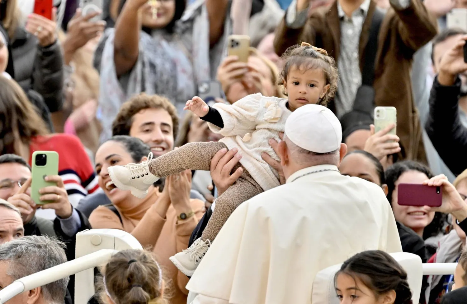 Pope Francis (C) greets attendees during his general audience in Saint Peter's Square, Vatican City, 15 November 2023.  EPA/ALESSANDRO DI MEO
