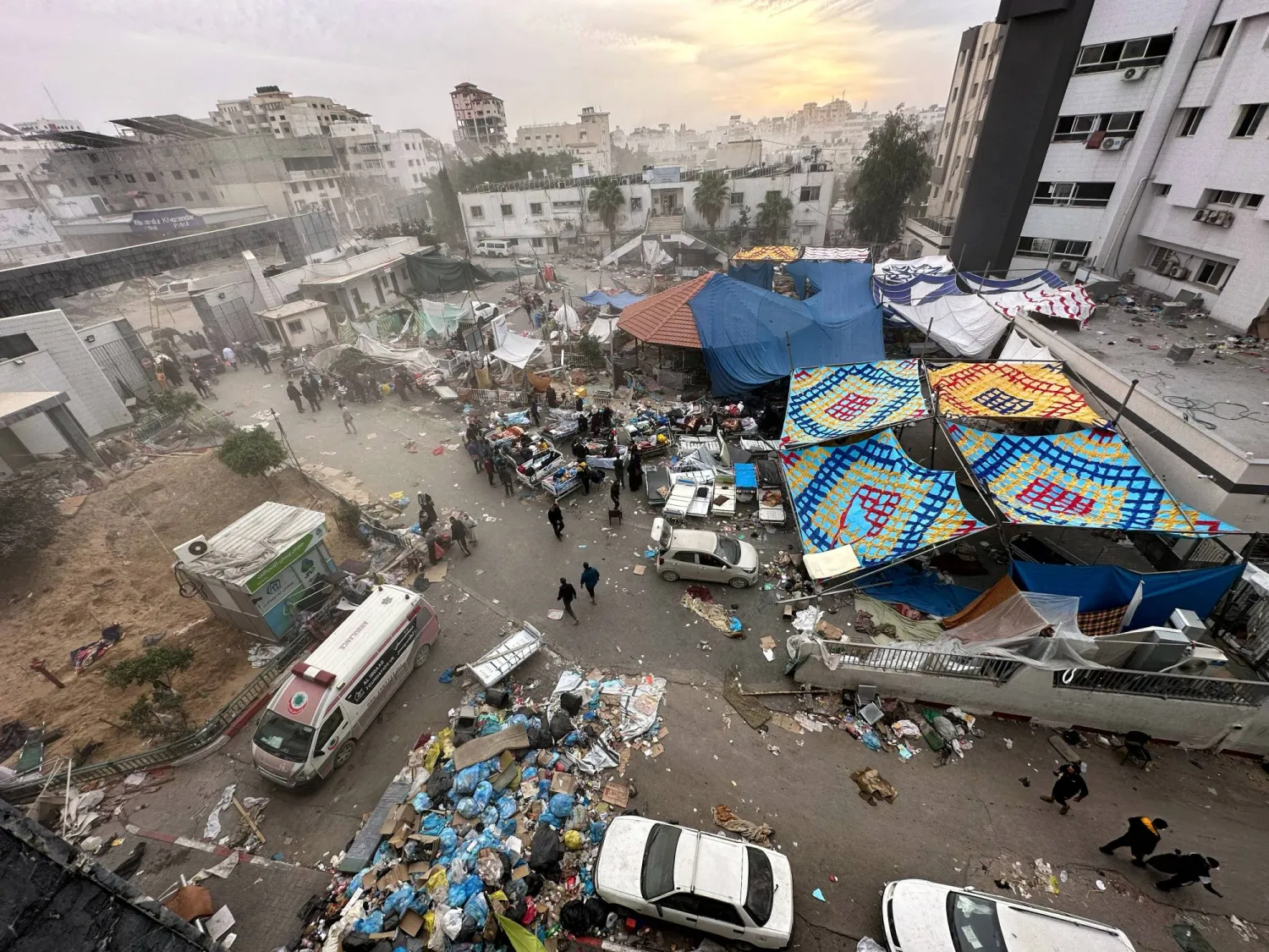 Palestinians inspect Al Shifa Hospital which was raided by Israeli forces during its ground operation, amid a temporary truce between Israel and Hamas, in Gaza City,  November 25, 2023. REUTERS/Abed Sabah 