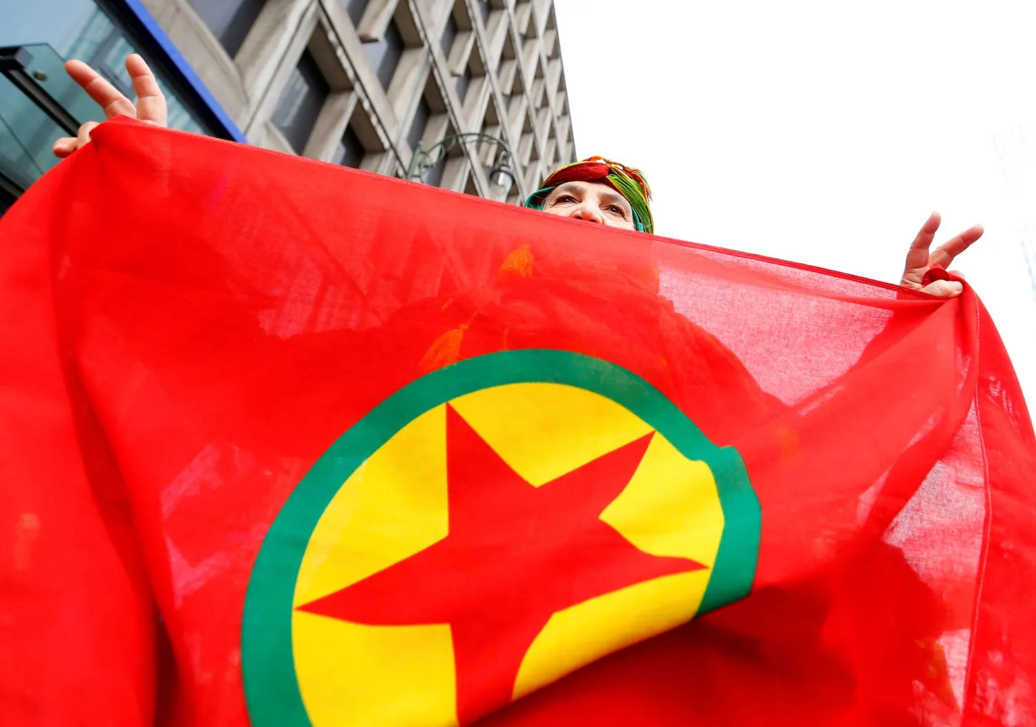 A woman holds a flag of the PKK (Kurdistan Workers' Party) during a demonstration against Turkish President Tayyip Erdogan in central Brussels, Belgium, November 17, 2016. REUTERS/Yves Herman/ File Photo