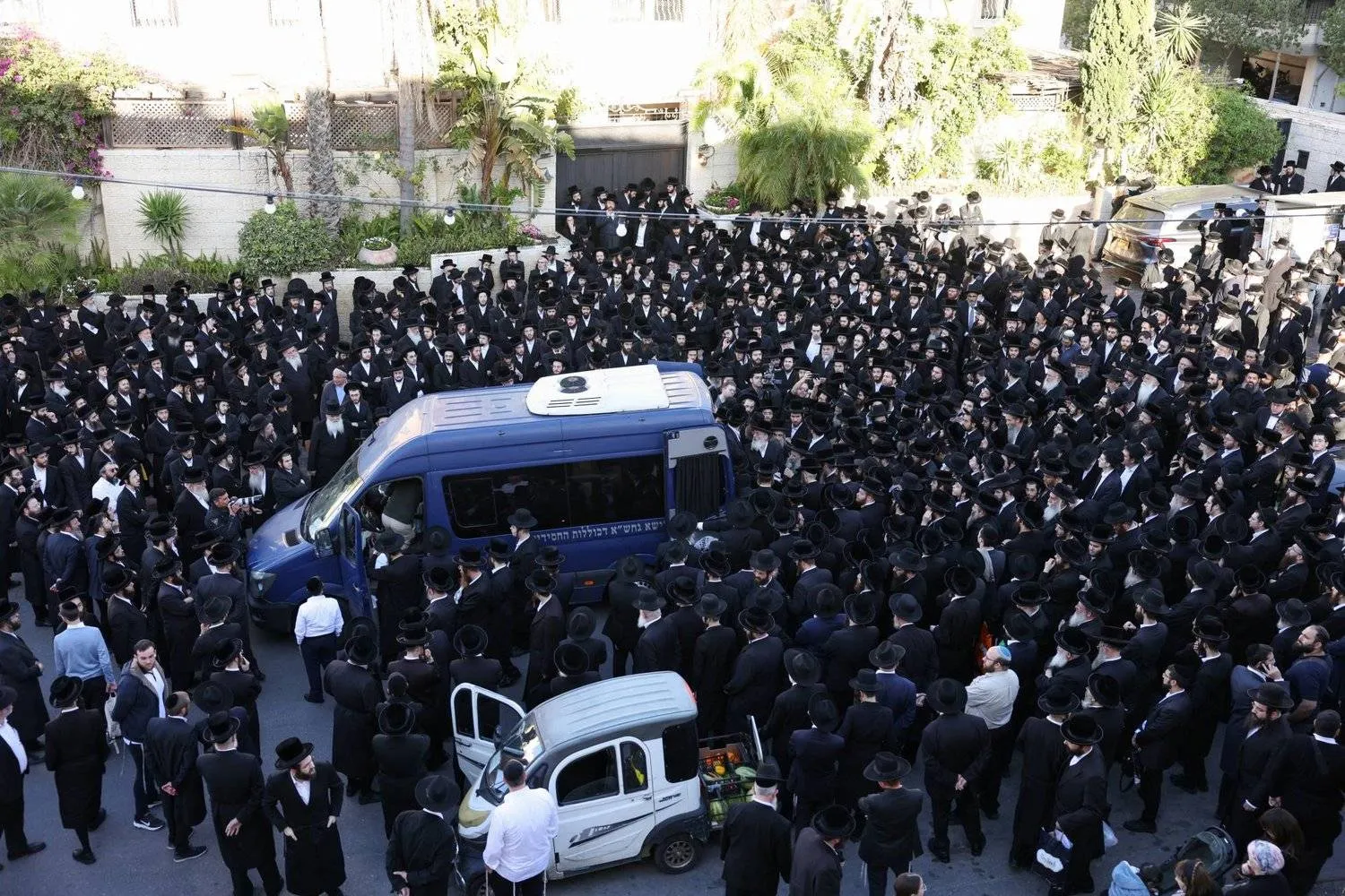 Friends and family gather at the funeral of Rabbi Elimelech Wasserman, who was killed in a shooting attack by Hamas gunmen on a bus stop at the entrance to Jerusalem on November 30, 2023 (Reuters)