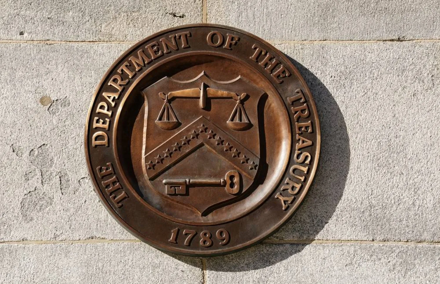 A bronze seal for the Department of the Treasury is shown at the US Treasury building in Washington, US, January 20, 2023. (Reuters)