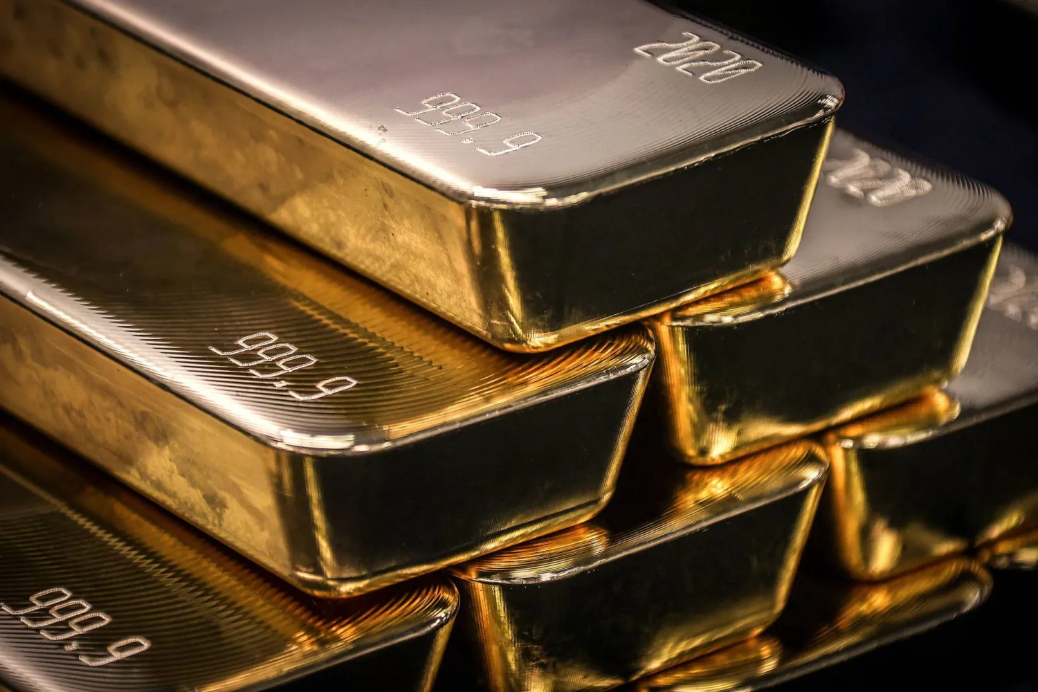 (FILES) Gold bullion bars are pictured after being inspected and polished at the ABC Refinery in Sydney on August 5, 2020. (Photo by DAVID GRAY / AFP)