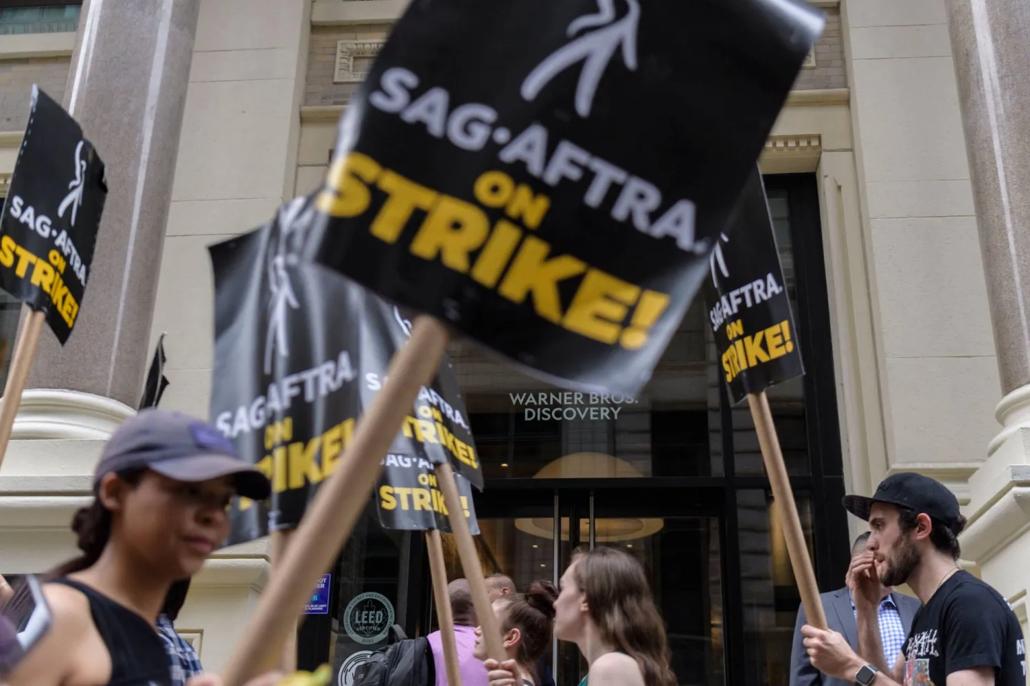 (FILES) SAG-AFTRA members and supporters walk the picket line as members of the Screen Actors Guild strike in New York on July 19, 2023. (Photo by ANGELA WEISS / AFP)