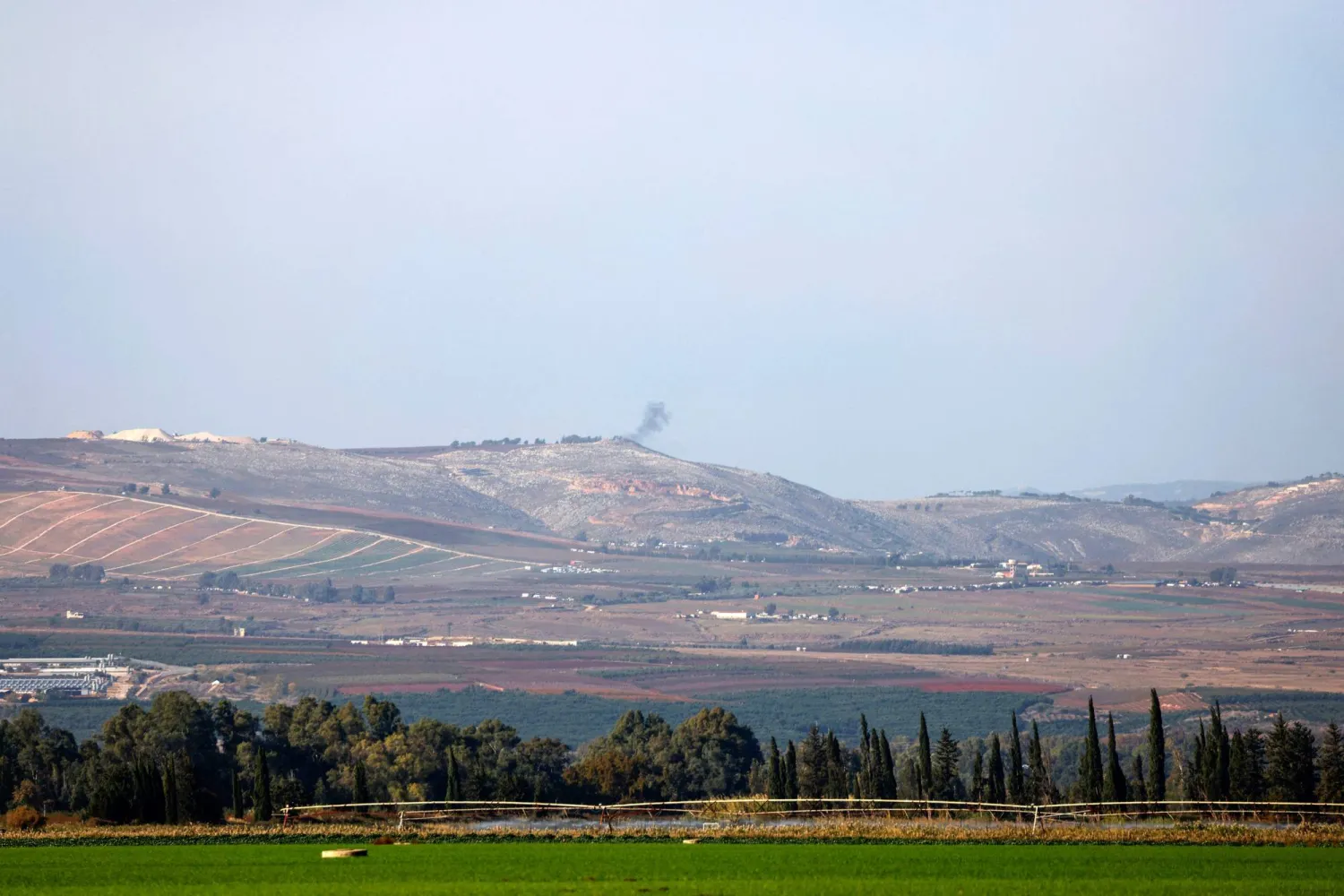 A picture taken from the Israeli side of the border with Lebanon shows Israeli artillery shelling of the southern Lebanese village of Adaisseh in response to anti-tank fire from Lebanon into northern Israel on December 3, 2023. (Photo by jalaa marey / AFP)