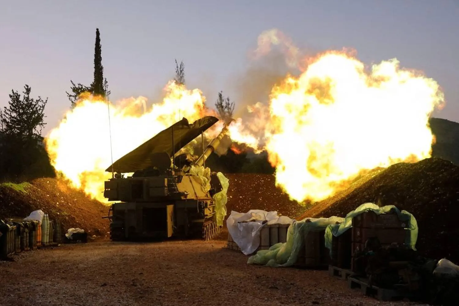  An Israeli artillery unit fires from a position in Upper Galilee in northern Israel towards southern Lebanon, on December 11, 2023, amid increasing cross-border tensions as fighting continues with Hamas militants in the southern Gaza Strip. (AFP)