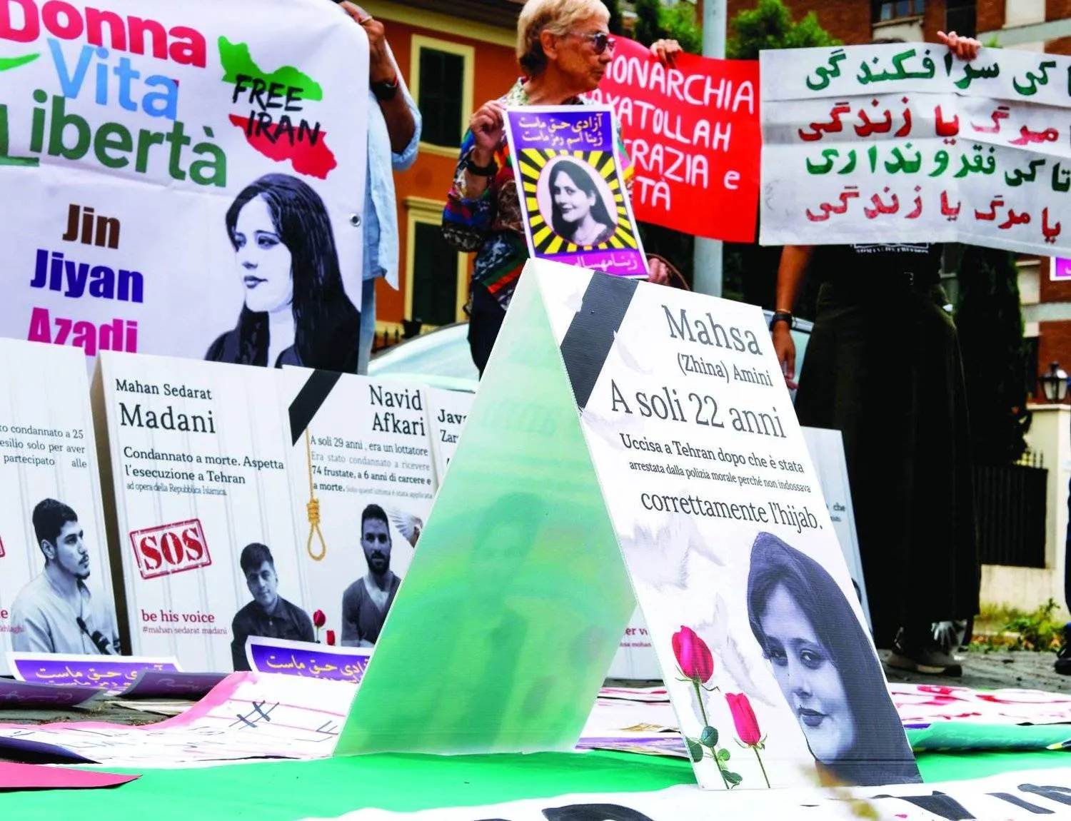 People attend a protest rally in Rome, Italy, Saturday, Sept. 16, 2023 to mark the first anniversary of the death of Mahsa Amini in the custody of Iran’s morality police. (Mauro Scrobogna/LaPresse via AP)
