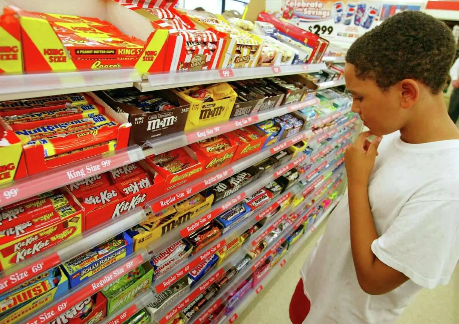 A shopper ponders candy options at a 7-Eleven store in Pembroke Pines, Fla. On June 15, 2017. Joe Raedle / Joe Raedle /Getty Images