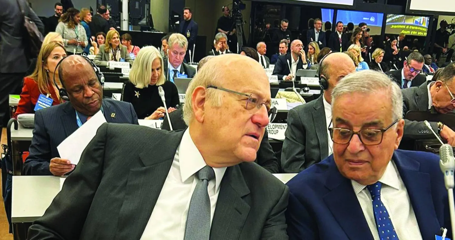 ميقاتي ووزير الخارجية عبد الله بوحبيب خلال مشاركتهما في المنتدى العالمي للاجئين في سويسرا (الوكالة الوطنية)