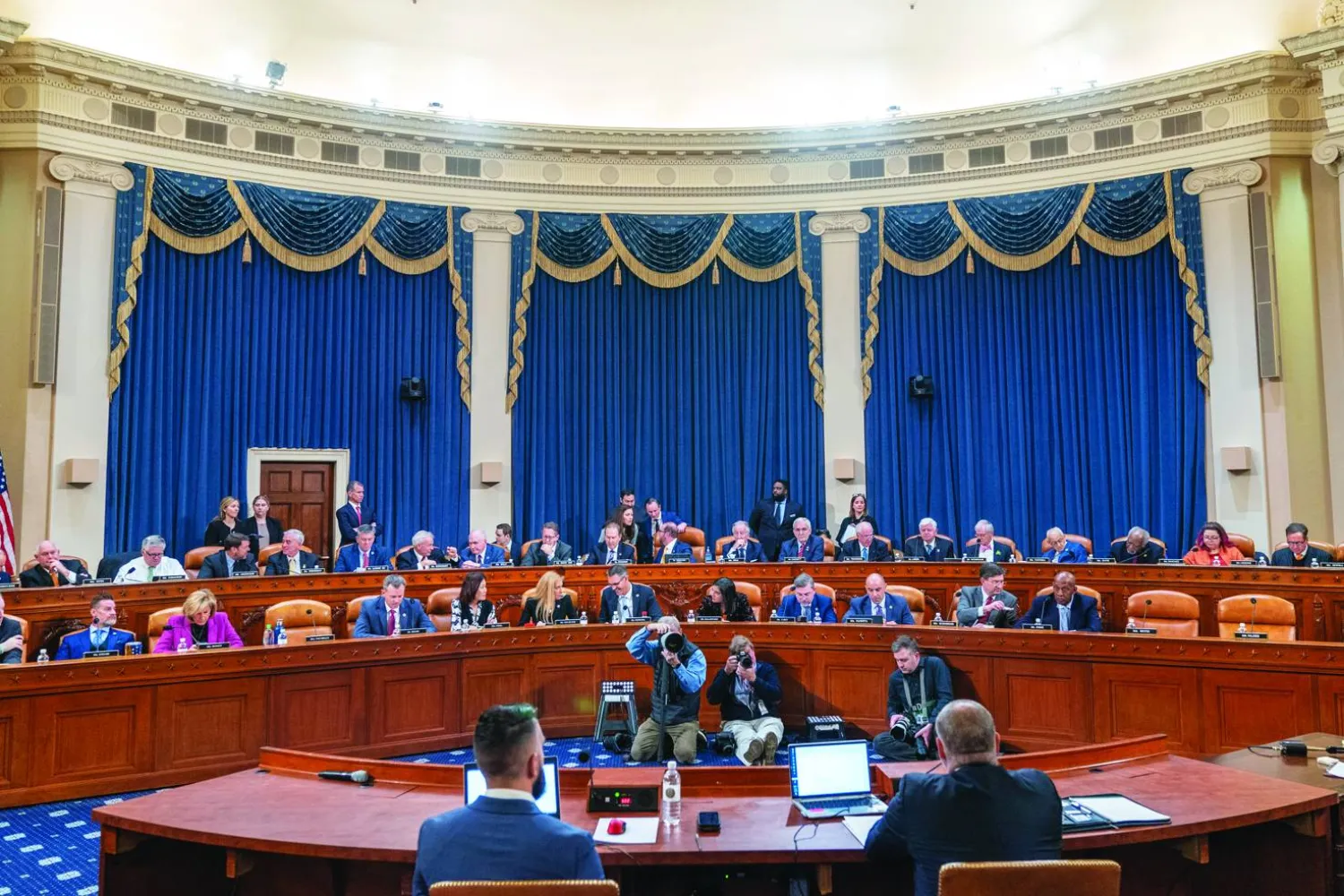 Joseph Ziegler, an IRS Agent, seated at left, and IRS Supervisory Special Agent Gary Shapley, right, wait to testify on the Hunter Biden investigation, as the House Ways and Means Committee takes a vote during their hearing, Tuesday, Dec. 5, 2023, on Capitol Hill in Washington. (AP Photo/Jacquelyn Martin)