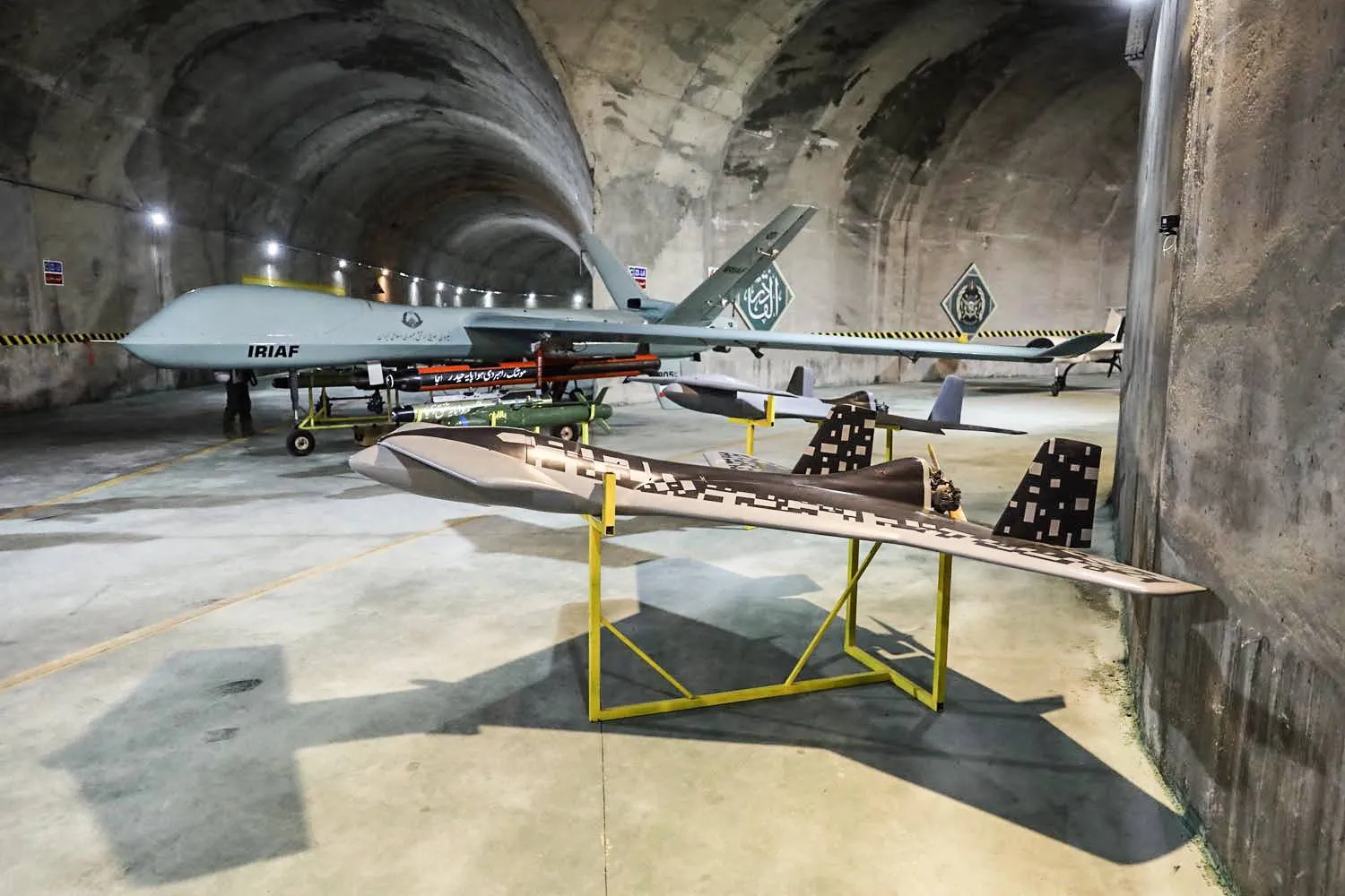 (FILES) This file handout picture provided by the Iranian Army on May 28, 2022, reportedly shows military unmanned aerial vehicles (UAVs or drones) at an underground base in an undisclosed location in Iran. (Photo by Iranian Army office / AFP)