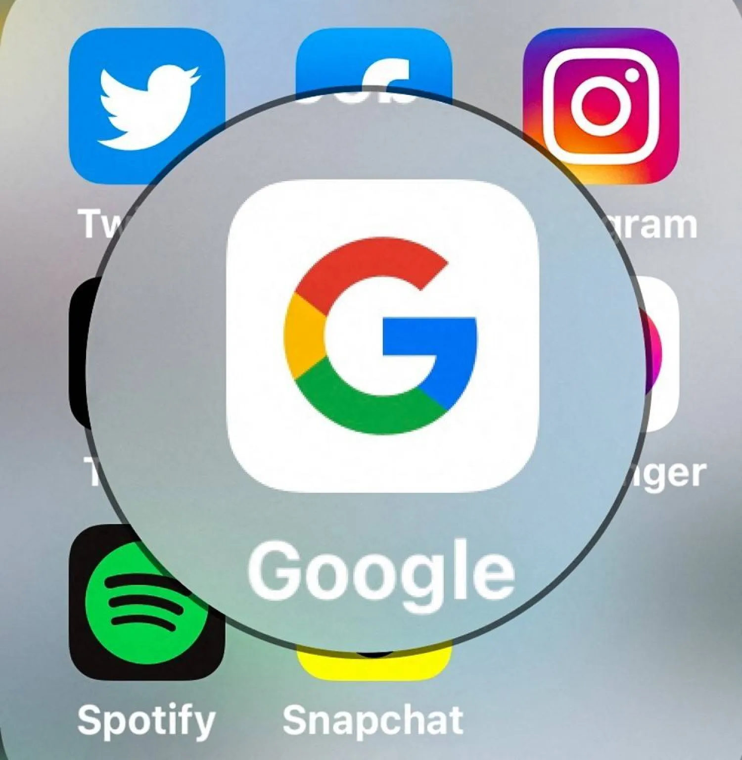 (FILES) This photograph taken on March 23, 2022, shows the logo of US multinational internet technology and services company Google (C) and other social media platforms displayed in Lille, northern France. (Photo by DENIS CHARLET / AFP)