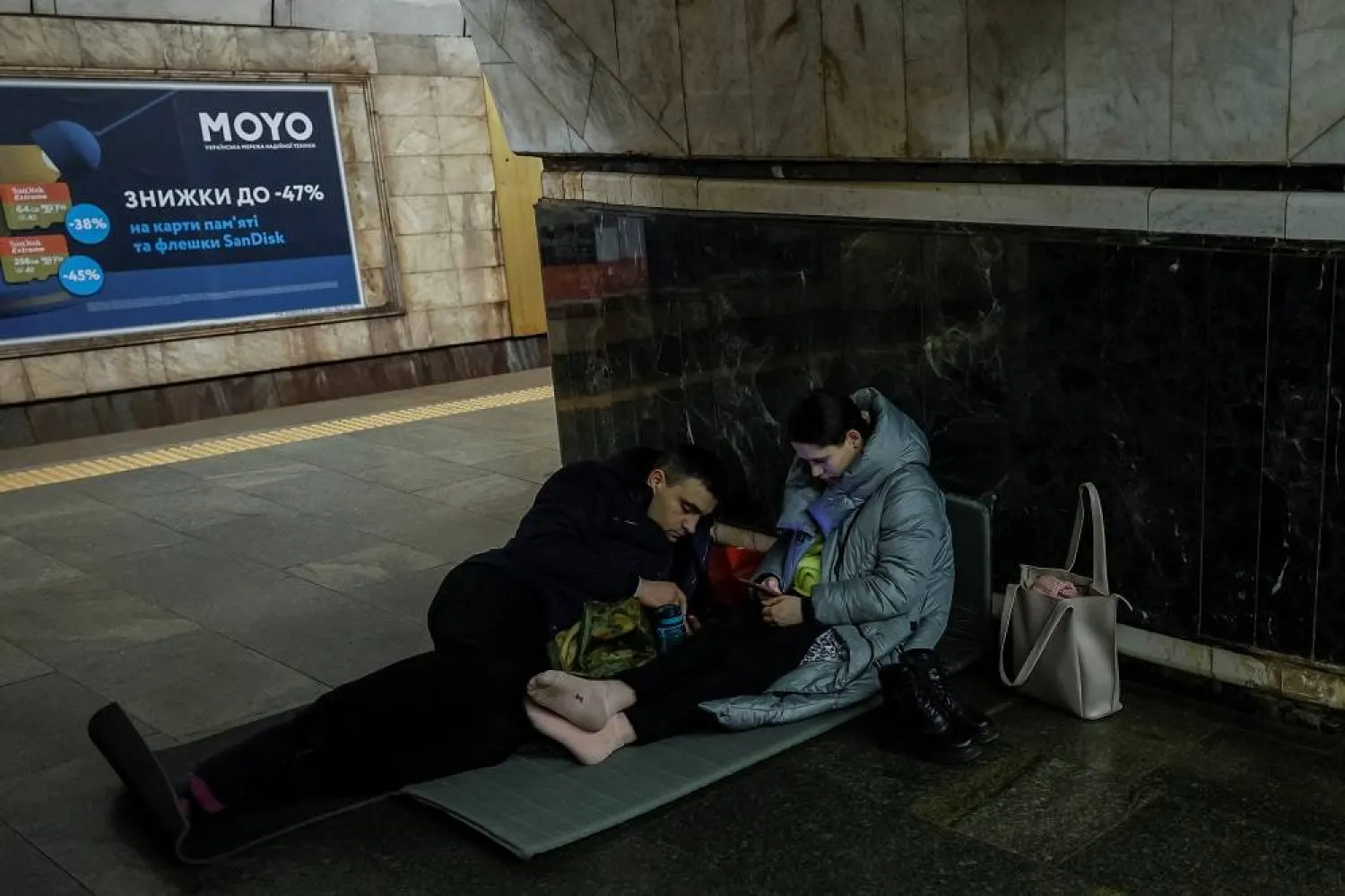 People take cover inside a subway station during an air raid alert at night, amid Russia's attack on Ukraine, in Kyiv, Ukraine, December 19, 2023. (Reuters)