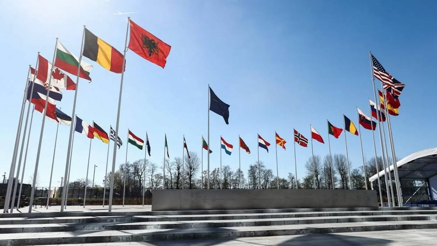 National flags of member countries in NATO flying outside organization headquarters in Brussels. (AFP)