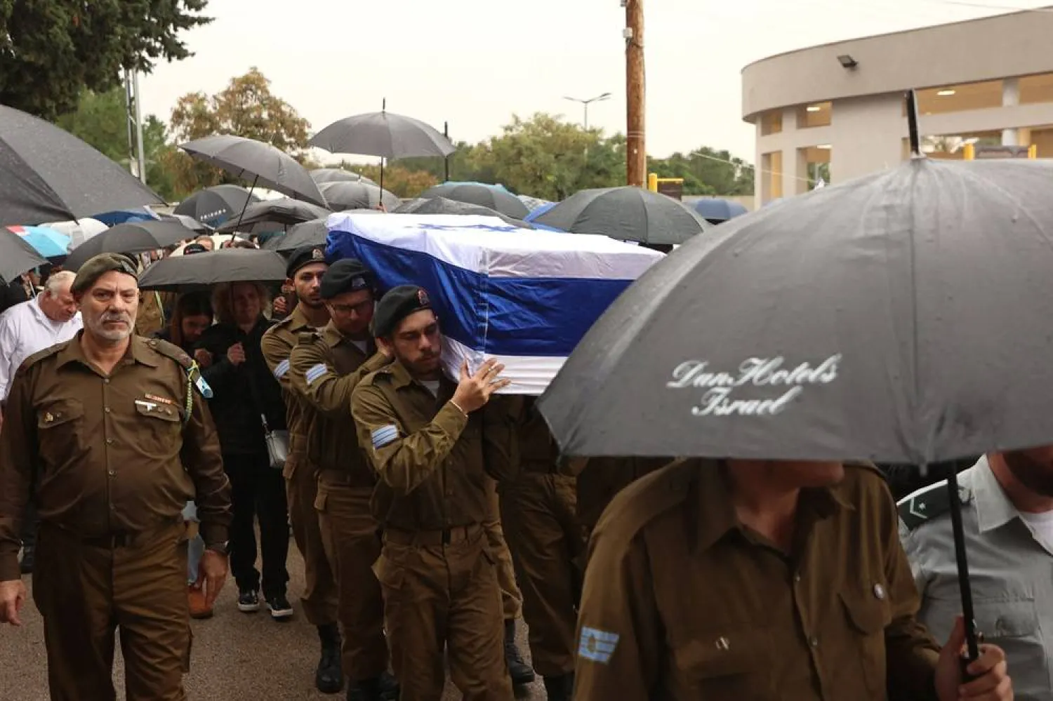  Mourners attend the funeral of 19-year-old Israeli soldier Amit Hod Ziv, who was killed in cross-border fighting with Lebanon's Hezbollah, at the military cemetery in the city of Rosh Haayin in central Israel on December 24, 2023. AFP)