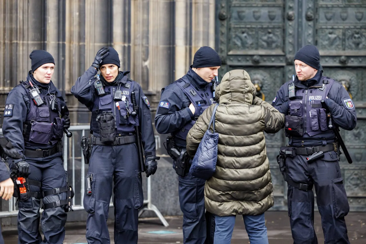 Police officers guard at the Cathedral in Cologne, Germany, 24 December 2023. EPA/CHRISTOPHER NEUNDORF
