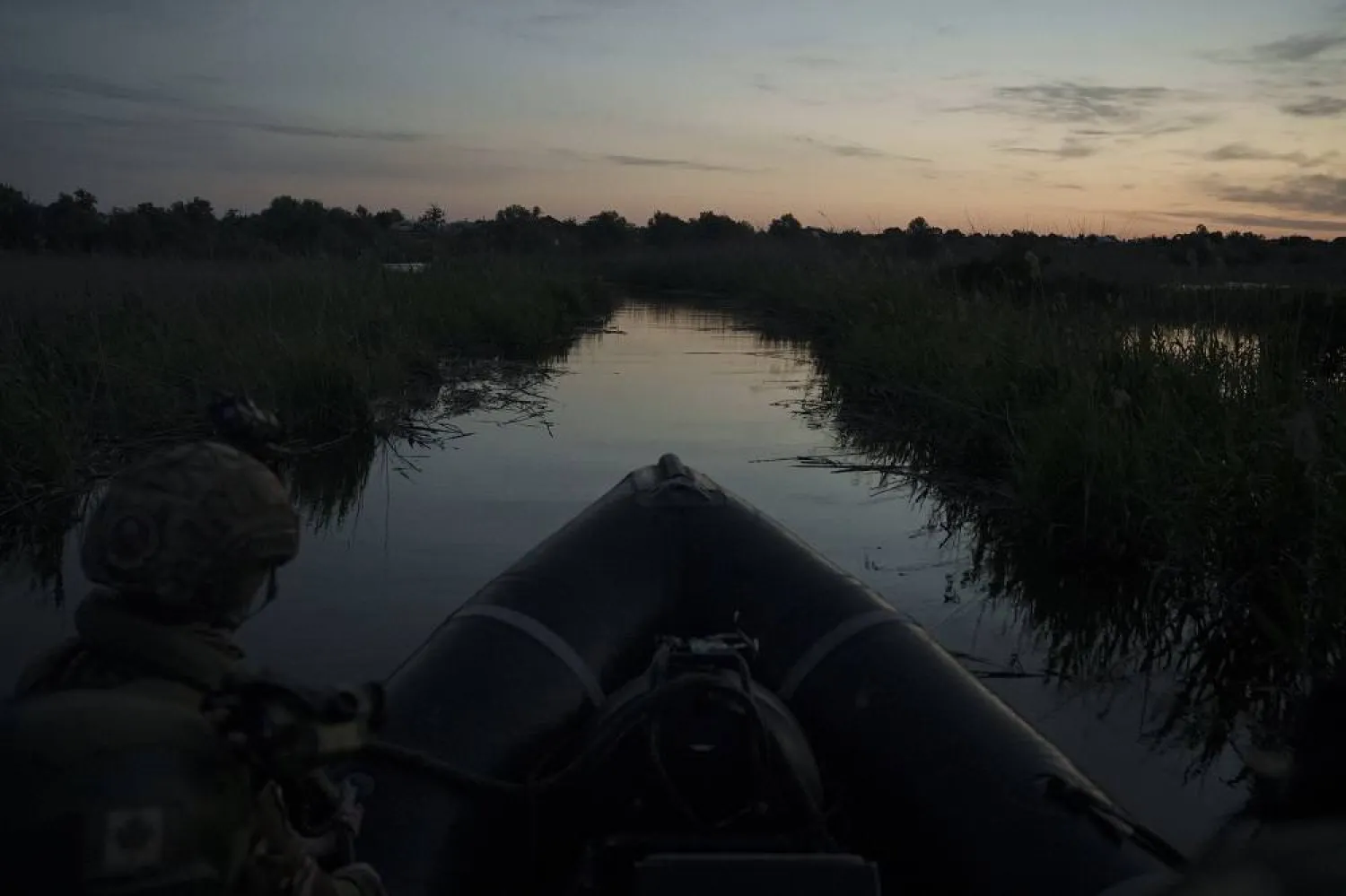 Ukraine Special Operations Forces navigate the Dnipro River before sunrise as they return from a night mission in Kherson region, Ukraine, Saturday, June 10, 2023. (AP)