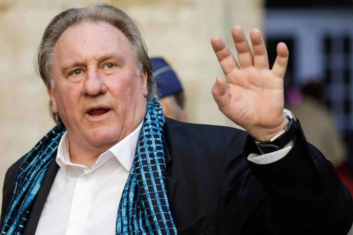In this file photo taken on June 25, 2018, French actor Gerard Depardieu waves as he arrives at the Town Hall in Brussels for a ceremony as part of the Brussels International Film Festival. (Briff). (AFP)