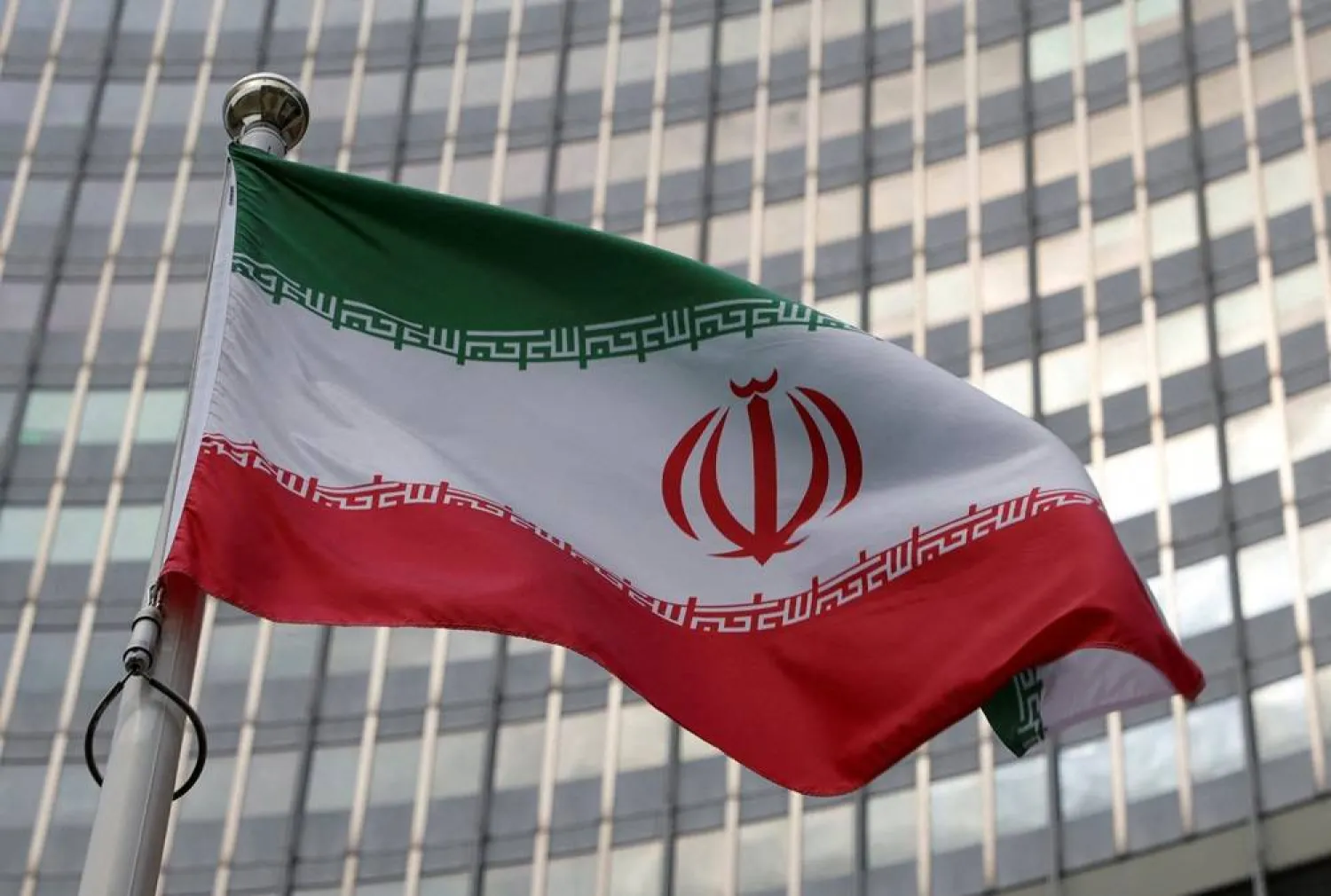 The Iranian flag flutters in front of the International Atomic Energy Agency (IAEA) organization's headquarters in Vienna, Austria, June 5, 2023. (Reuters)