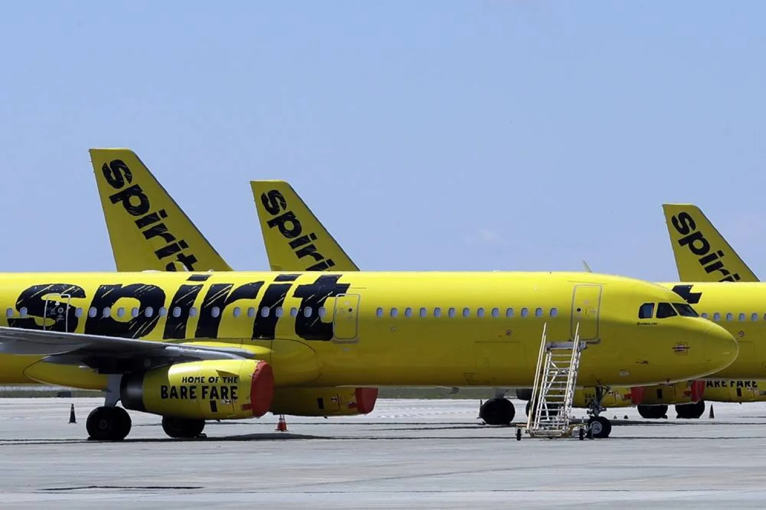A line of Spirit Airlines jets sit on the tarmac at Orlando International Airport on May 20, 2020, in Orlando, Fla. (AP)