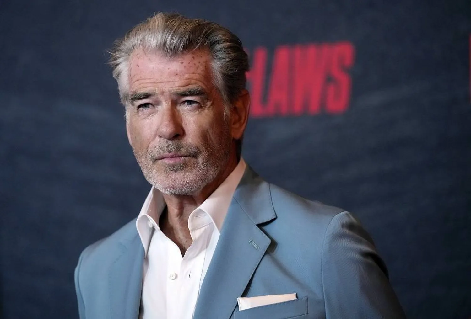 Pierce Brosnan, a cast member in "The Out-Laws," poses at a special screening of the film, Monday, June 26, 2023, at the Regal LA Live theaters in Los Angeles. (AP)