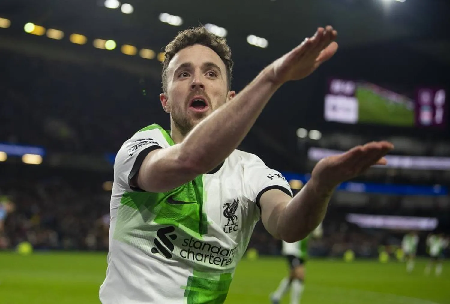 Diogo Jota of Liverpool celebrates after scoring the second goal during the English Premier League soccer match between Burnley FC and Liverpool FC, in Burnley, Britain, 26 December 2023. (EPA)
