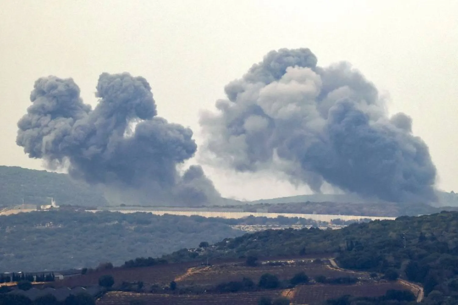 This picture taken from a position along the border in northern Israel on December 27, 2023 shows smoke billowing in the southern Lebanese village of Marwahin following Israeli bombardment amid ongoing cross-border tensions as fighting continues between Israel and Hamas militants in the Gaza Strip. (AFP)