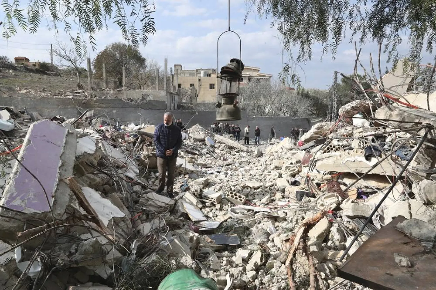 A Lebanese man stands on the rubble of a house that was destroyed by an Israeli airstrike Tuesday night, in Bint Jbeil, South Lebanon, Wednesday, Dec. 27, 2023. (AP)