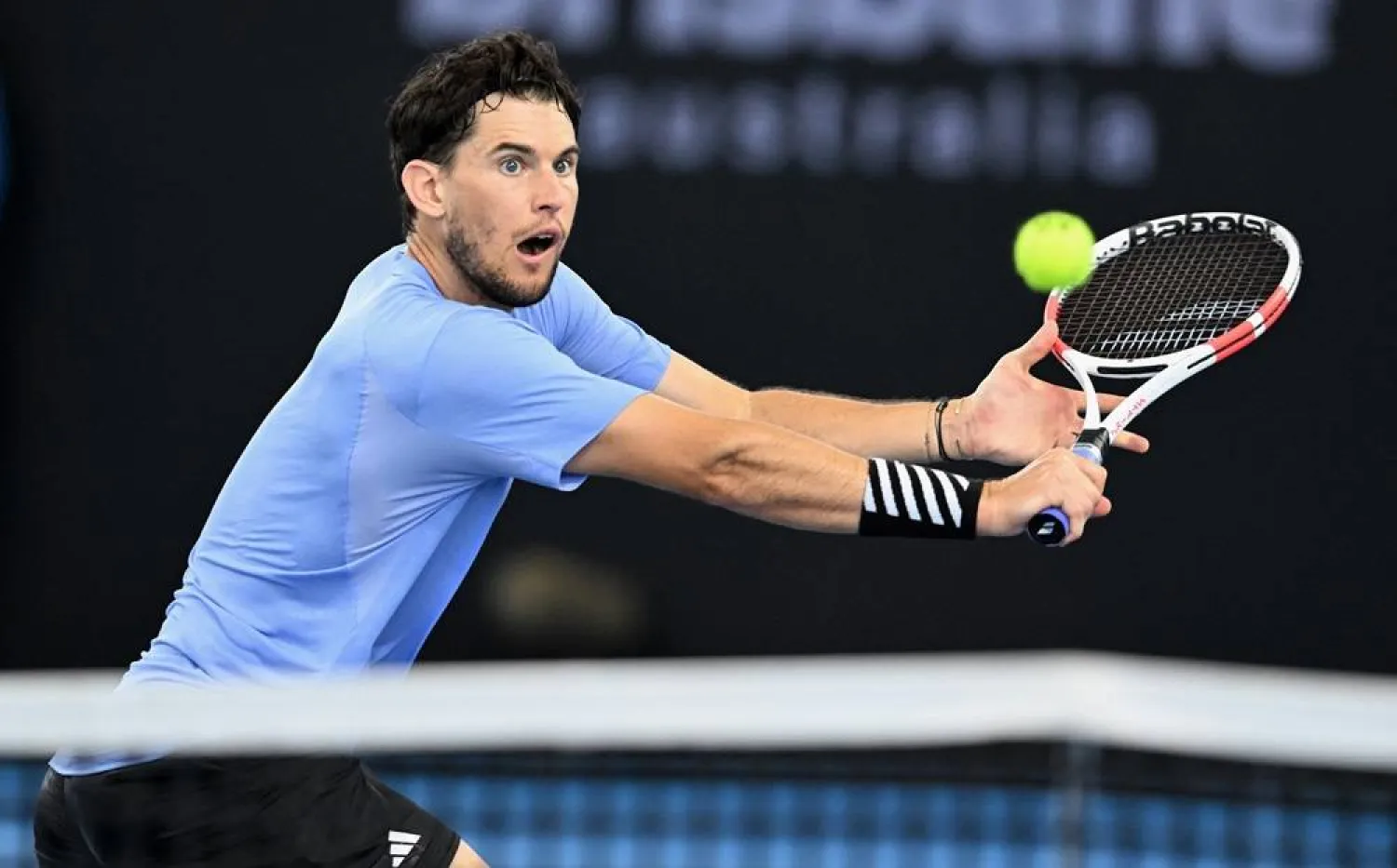 Dominic Thiem of Austria in action against James McCabe of Australia during their qualifying round match of Brisbane International, at Queensland Tennis Centre in Brisbane, Australia, 30 December 2023. (EPA)