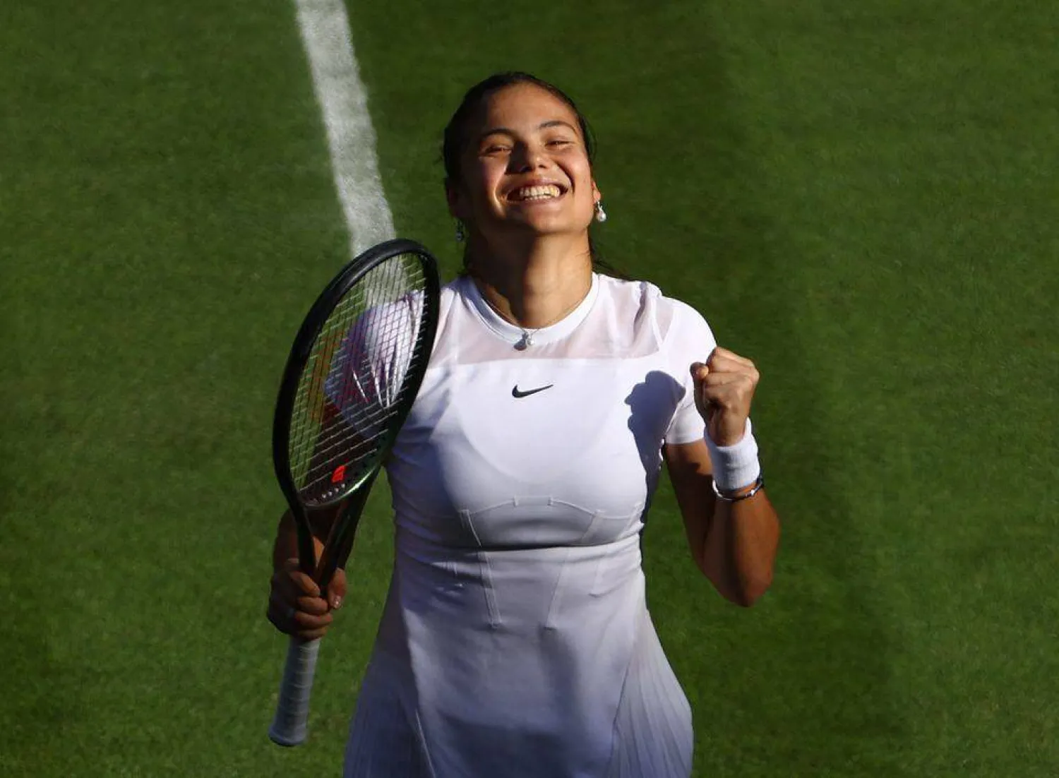 Tennis - Wimbledon - All England Lawn Tennis and Croquet Club, London, Britain - June 27, 2022 Britain's Emma Raducanu celebrates winning her first round match against Belgium's Alison Van Uytvanck REUTERS/Hannah Mckay