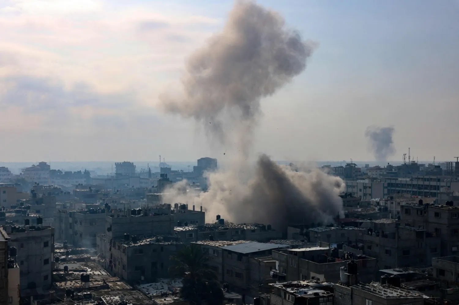 A plume of smoke rises during an Israeli strike on the Rafah refugee camp in the southern Gaza Strip on December 1, 2023, as fighting resumed shortly after the expiration of a seven-day truce between Israel and Hamas militants. (AFP) 