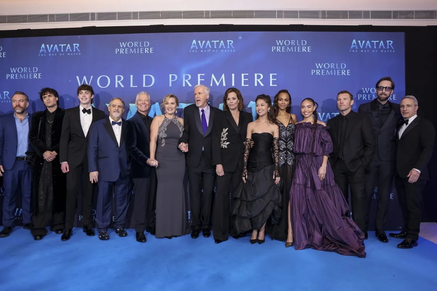 Brendan Cowell, from left, Jamie Flatters, Jack Champion, producer Jon Landau, Stephen Lang, Kate Winslet, director James Cameron, Sigourney Weaver, Trinity Jo-Li Bliss, Zoe Saldana, Bailey Bass, Sam Worthington, Joel David Moore, and Steve Asbell pose for photographers upon arrival at the World premiere of the film 'Avatar: The Way of Water' in London, Tuesday, Dec. 6, 2022. (AP)